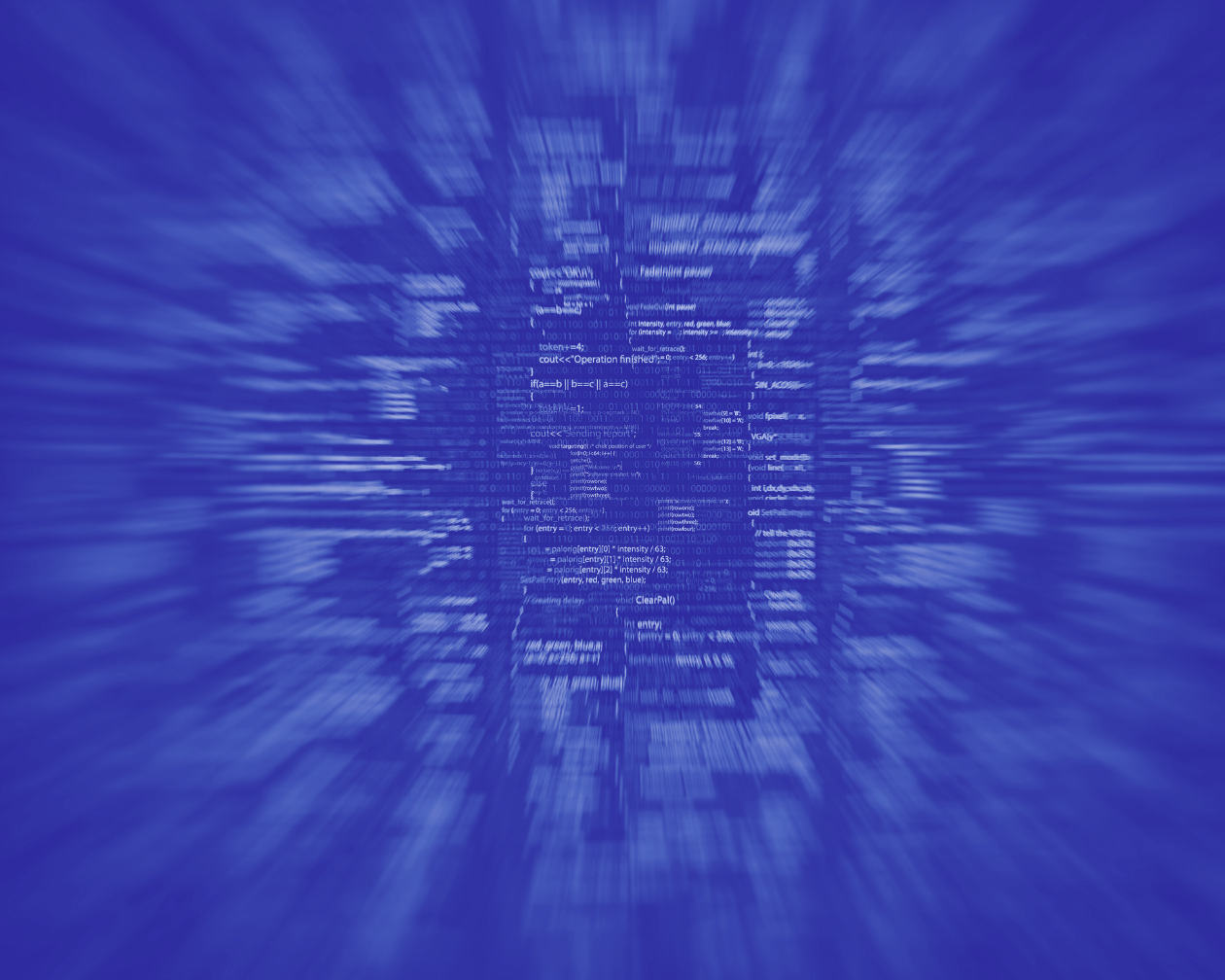 Blue monochrome image of computer code with motion blur.